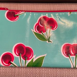 Vintage oilcloth cosmetic bag. 8.5” x 5.5”. Never used, excellent condition.
